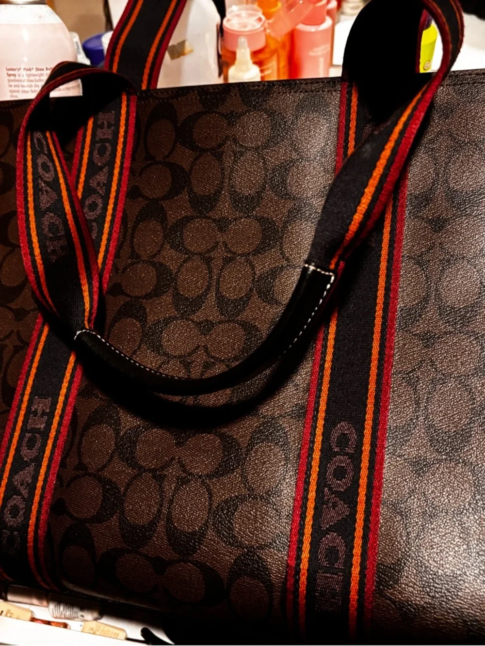 Coach Men’s Brown Signature Canvas Tote with Black and Red Striped Webbing